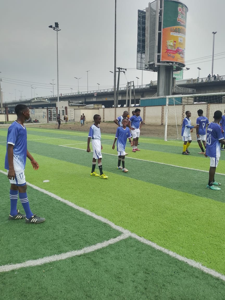 Academy players warming up on an artificial turf pitch