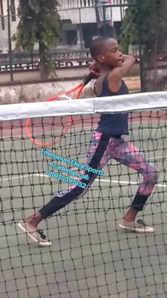 Young athlete executing a tennis backhand swing
